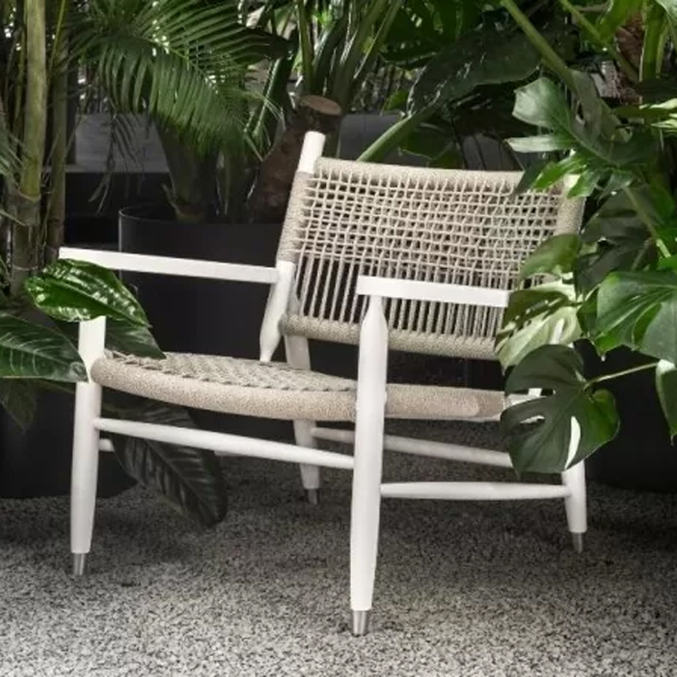 flexform outdoor tessa lounge chair grey front view with plants round